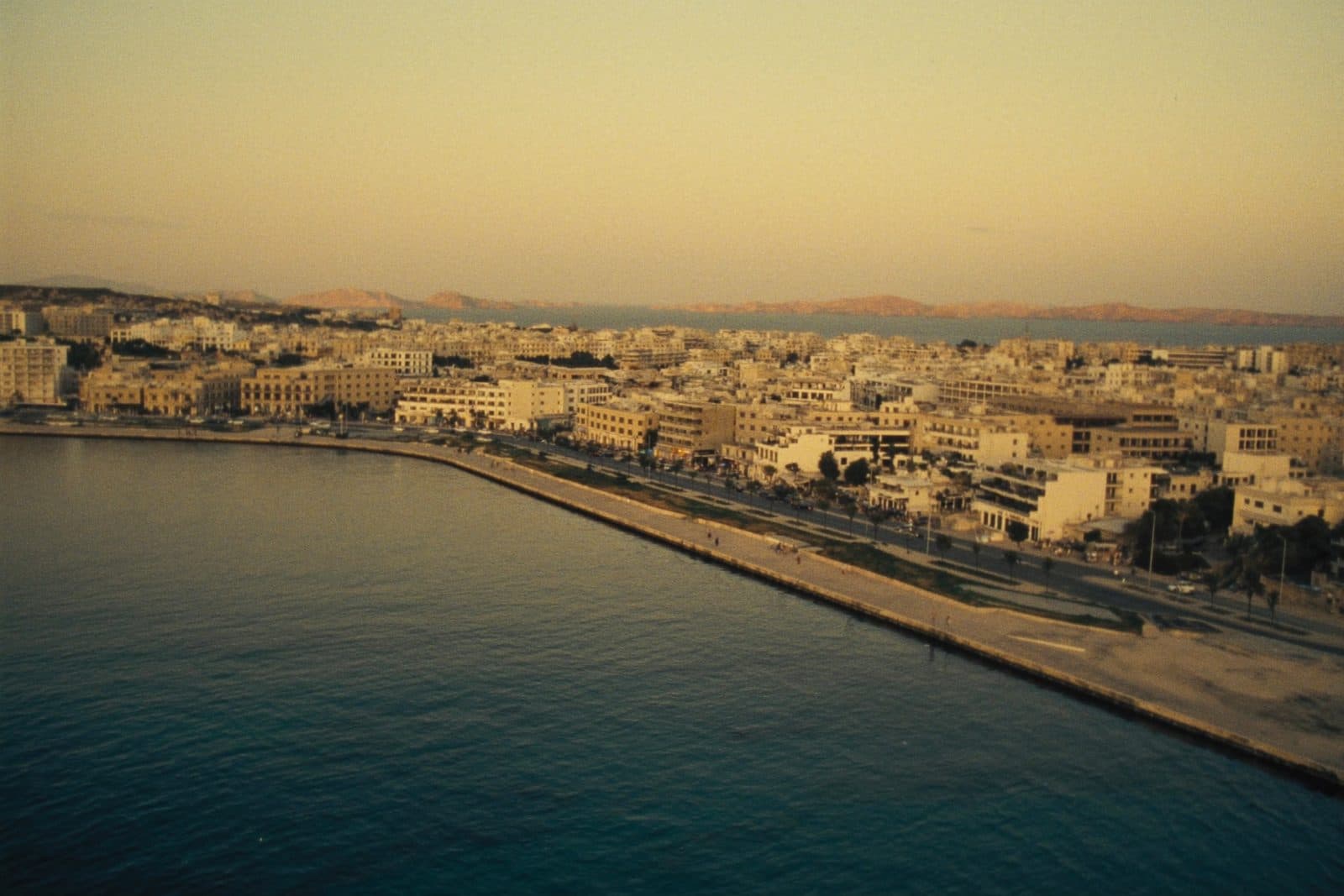 Golden-hour view over St Paul's Bay and the Bugibba seafront, northern Malta