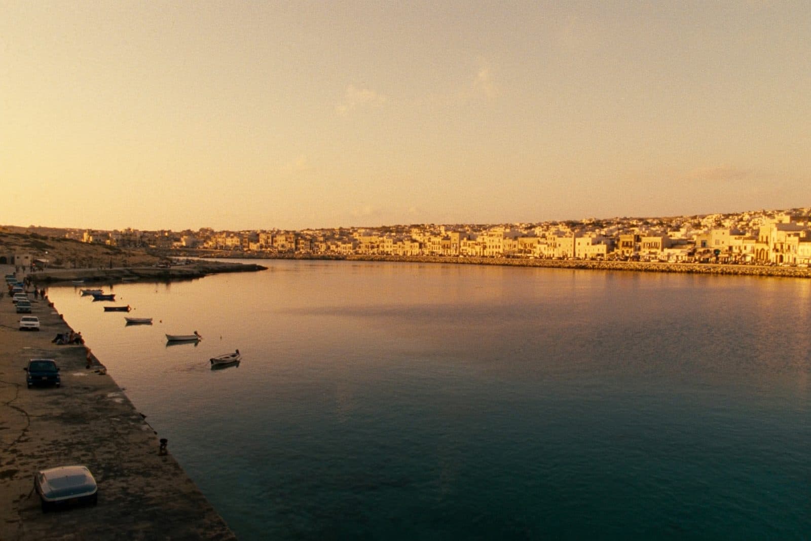 Golden-hour view over Marsaskala bay and waterfront, south-eastern Malta